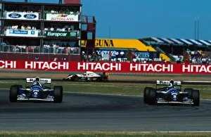 Formula One World Championship: Damon Hill Williams FW16 passes team mate David Coulthard during qualifying