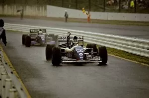 Formula One World Championship: Damon Hill Williams FW16 celebrates his victory as he enters the pit lane in