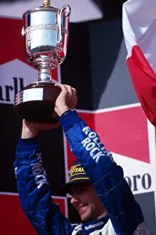 Formula One World Championship: Damon Hill Williams, is presented with the second placed trophy