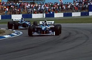 Damon Hill 1996 Collection: Formula One World Championship: Damon Hill Williams FW18 leads eventual winner team mate Jacques