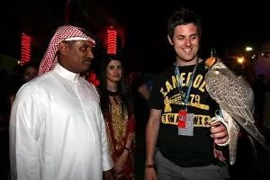 Images Dated 23rd April 2009: Formula One World Championship: Daniel Kalisz with a Falconer at the Bahrain GP welcome party