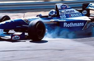 Images Dated 6th October 2004: Formula One World Championship: David Coulthard Williams FW17 locks a wheel on the way to his
