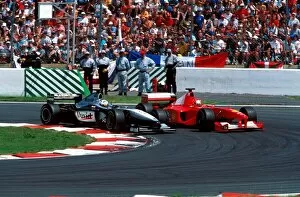 France Gallery: Formula One World Championship: David Coulthard Mclaren MP4-15 gets by Schumacher at the hairpin