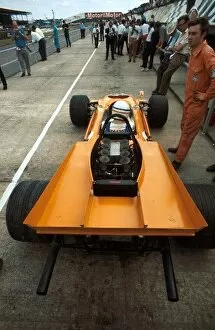 1969 Collection: Formula One World Championship: Derek Bell test drives the four wheel drive McLaren M9A