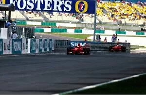 Images Dated 5th August 2002: Formula One World Championship: Eddie Irvine Ferrari F399 took a victory aided by second placed