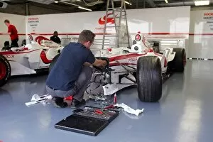Images Dated 6th June 2006: Formula One World Championship: A engineer prepares a Super Aguri F1 Car before the British Grand