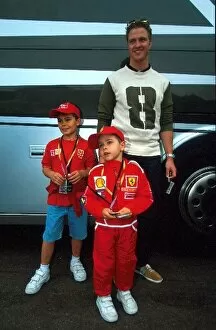 2002 Collection: Formula One World Championship F: Ralf Schumacher poses with some of his Brothers fans
