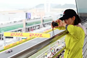 Images Dated 23rd October 2010: Formula One World Championship: A fan photographs qualifying