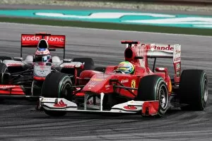 Formula One World Championship: Felipe Massa Ferrari F10 and Jenson Button McLaren MP4/25 battle for position