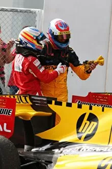 Formula One World Championship: Fernando Alonso Ferrari with Vitaly Petrov Renault in parc ferme