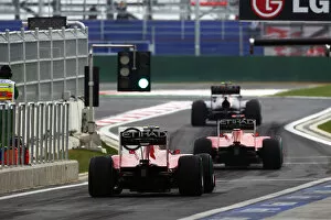 Best Images Collection: Formula One World Championship: Fernando Alonso Ferrari F10 follows Mark Webber Red Bull Racing RB6