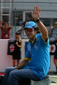 Images Dated 25th July 2004: Formula One World Championship: Fernando Alonso waves to the crowd
