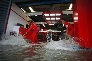 2008 Collection: Formula One World Championship: The Ferrari pit garage is flooded during a storm in first practice