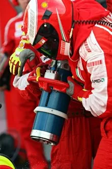 Images Dated 21st May 2009: Formula One World Championship: Ferrari refuel Kimi Raikkonen Ferrari