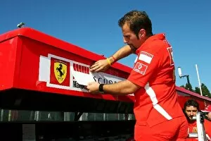 Images Dated 8th September 2005: Formula One World Championship: Ferrari remove the Marlboro branding from the pit gantry