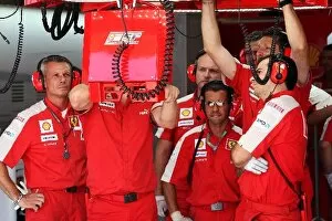 Formula One World Championship: Ferrari team watch practice