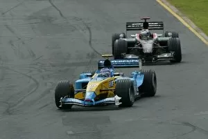 Images Dated 9th March 2003: Formula One World Championship: Fifth placed Jarno Trulli Renault R23 leads eleventh placed Jos