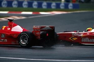 Formula One World Championship: Fourth place finisher Ralf Schumacher Williams FW21 makes a move on his brother Michael