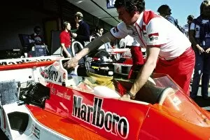 Jarama Collection: Formula One World Championship: Gary Anderson McLaren Chief Mechanic pushes back the McLaren M26