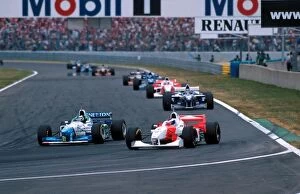 Overtake Gallery: Formula One World Championship: Gerhard Berger Benetton B196 overtakes Mika Hakkinen for 4th place