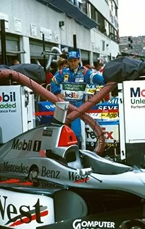 Formula One World Championship: Gerhard Berger looks longingly at the Mclaren