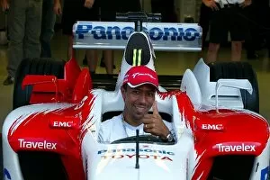 Images Dated 3rd August 2003: Formula One World Championship: Giovane Elber Bayern Munich Footballer sits in the Toyota TF103