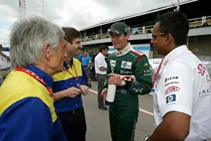 Formula One World Championship: A happy Mark Webber Jaguar meets with Pierre Dupasquier Michelin Director of Worldwide