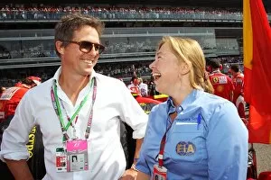 Images Dated 12th September 2010: Formula One World Championship: Hugh Grant Actor on the grid with Alexandra Schieren