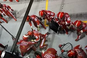 Images Dated 28th September 2008: Formula One World Championship: Injured Ferrari mechanics after pitstops