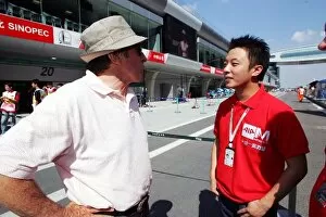 Images Dated 23rd September 2004: Formula One World Championship: Jackie Stewart talks with Marchy Lee Yin Kin