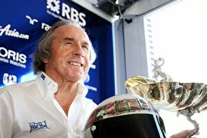 Images Dated 11th September 2009: Formula One World Championship: Jackie Stewart with the trophy he collected for winning the 1969