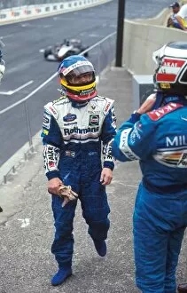 Formula One World Championship: Jacques Villeneuve Williams FW19, 1st place talks with Gerhard Berger Benetton B197 2nd
