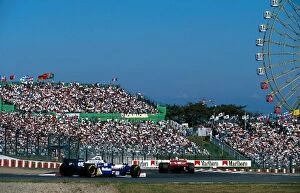 Images Dated 9th January 2001: Formula One World Championship: Jacques Villeneuve Williams FW18 follows Mika Hakkinen Mclaren