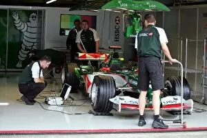 Images Dated 21st October 2004: Formula One World Championship: Jaguar mechanics prepare a Jaguar F1 car for the last time
