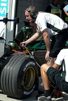 Images Dated 23rd August 2003: Formula One World Championship: Jaguar mechanics work on a Jaguar R4