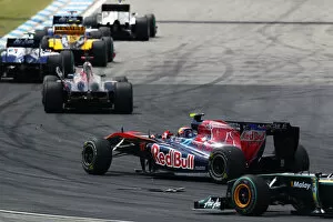Images Dated 25th July 2010: Formula One World Championship: Jaime Alguersuari Scuderia Toro Rosso STR5 crashes with team mate