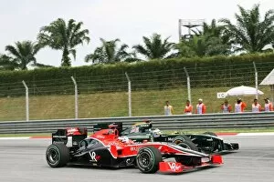 Best Images Collection: Formula One World Championship: Jarno Trulli Lotus T127 and Timo Glock Virgin Racing VR-01 battle