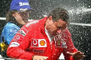 Images Dated 26th July 2005: Formula One World Championship: Jean Todt Ferrari Sporting Director celebrates on the podium