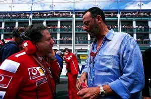 Images Dated 7th July 2003: Formula One World Championship: Jean Todt Ferrari Sporting Director talks with actor Jean Reno