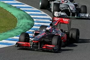 Formula One World Championship: Jenson Button McLaren MP4 / 25 leads Michael Schumacher Mercedes GP MGP W01