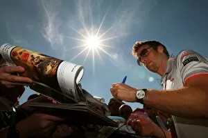 Formula One World Championship: Jenson Button McLaren signs autographs for the fans