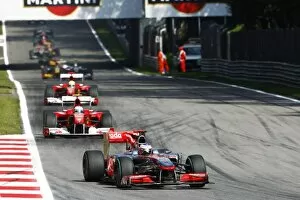Formula One World Championship: Jenson Button McLaren MP4/25 leads on the opening lap of the race