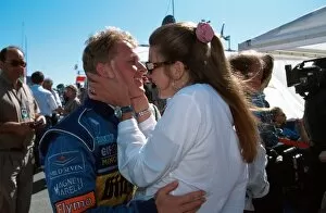 Formula One World Championship: Johnny Herbert is embraced by his wife Becky after his excellent 2nd place