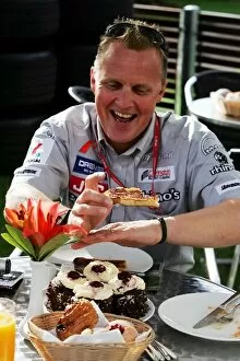 Images Dated 31st March 2006: Formula One World Championship: Johnny Herbert MF1 Sporting Relations Manager protects his cake