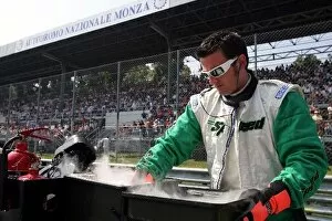 Images Dated 5th September 2005: Formula One World Championship: Jordan mechanic with dry ice on the grid