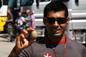 Images Dated 10th June 2010: Formula One World Championship: Karun Chandhok Hispania Racing F1 Team with his lucky egg