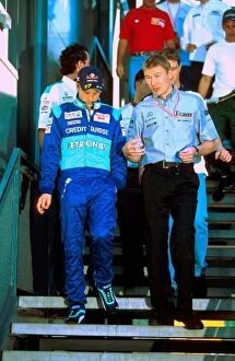Images Dated 14th September 2003: Formula One World Championship: Kimi Raikkonen Sauber Petronas C20 talks with Mika Hakkinen