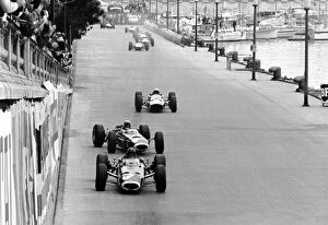 1965 Collection: Formula One World Championship: Lap 1: Winner Graham Hill BRM P261 leads a sideways Jackie Stewart