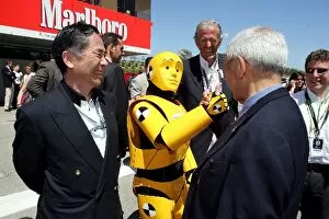 Images Dated 8th May 2005: Formula One World Championship: A man dressed as a crash test dummy with some guests