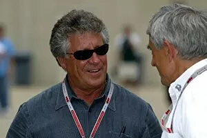 Images Dated 18th June 2004: Formula One World Championship: Mario Andretti talks with Pierre Dupasquier Michelin Director of
